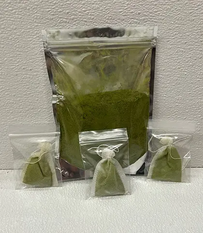 Green powder in plastic packaging