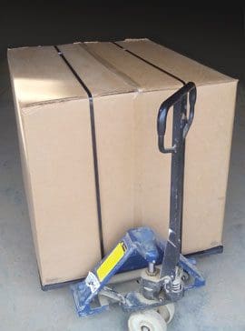 Cardboard box secured on pallet jack